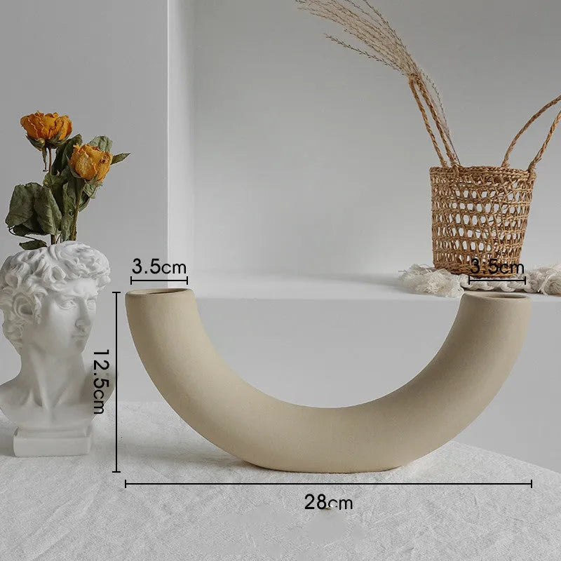 Unglazed matte ceramic dry flower vase with textured surface in Nordic style