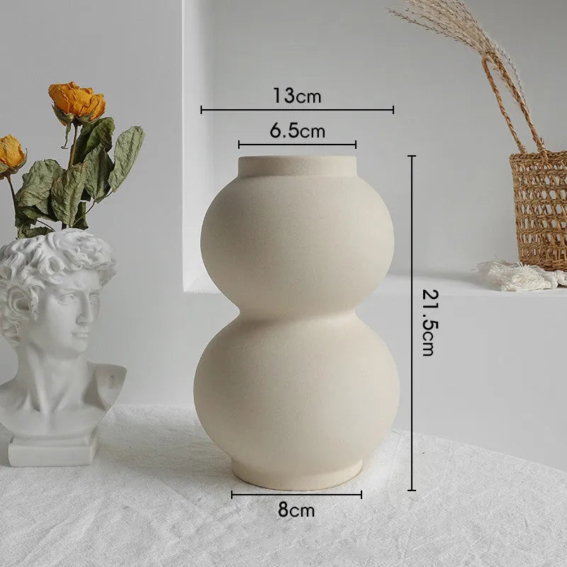 Unglazed matte ceramic dry flower vase with textured surface in Nordic style