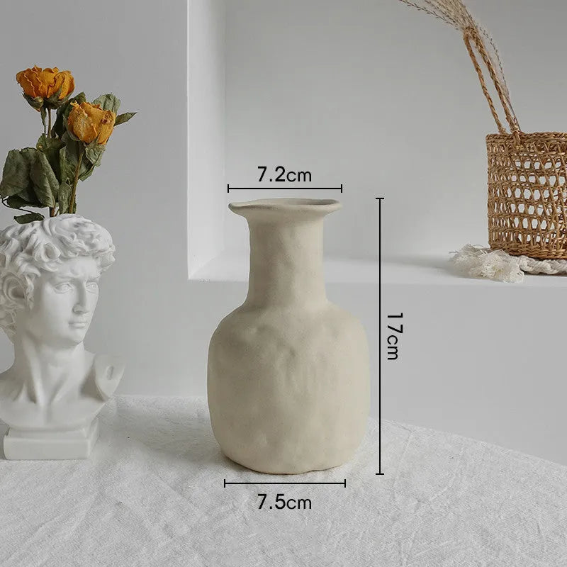Unglazed matte ceramic dry flower vase with textured surface in Nordic style