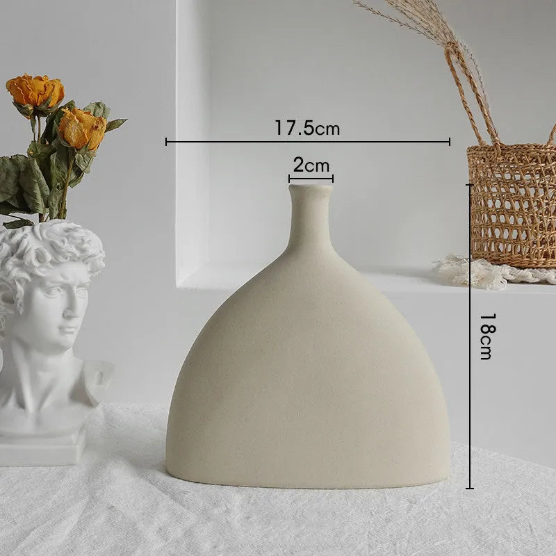 Unglazed matte ceramic dry flower vase with textured surface in Nordic style