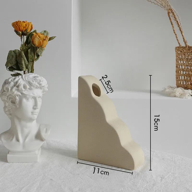 Unglazed matte ceramic dry flower vase with textured surface in Nordic style