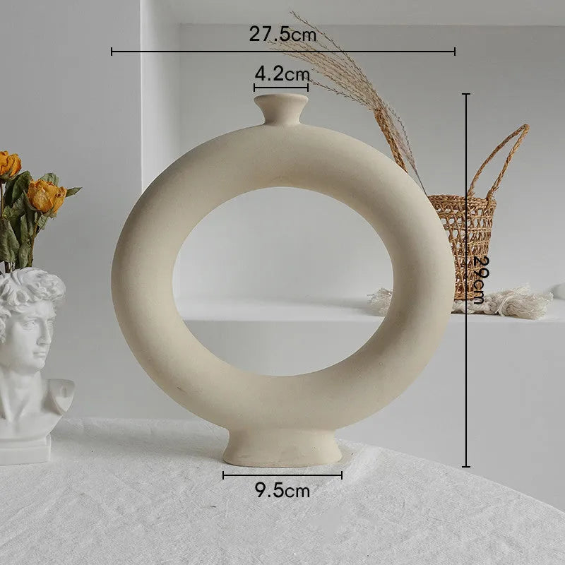 Unglazed matte ceramic dry flower vase with textured surface in Nordic style