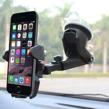 Black ABS plastic car phone holder clipped onto car vent with smartphone in landscape orientation