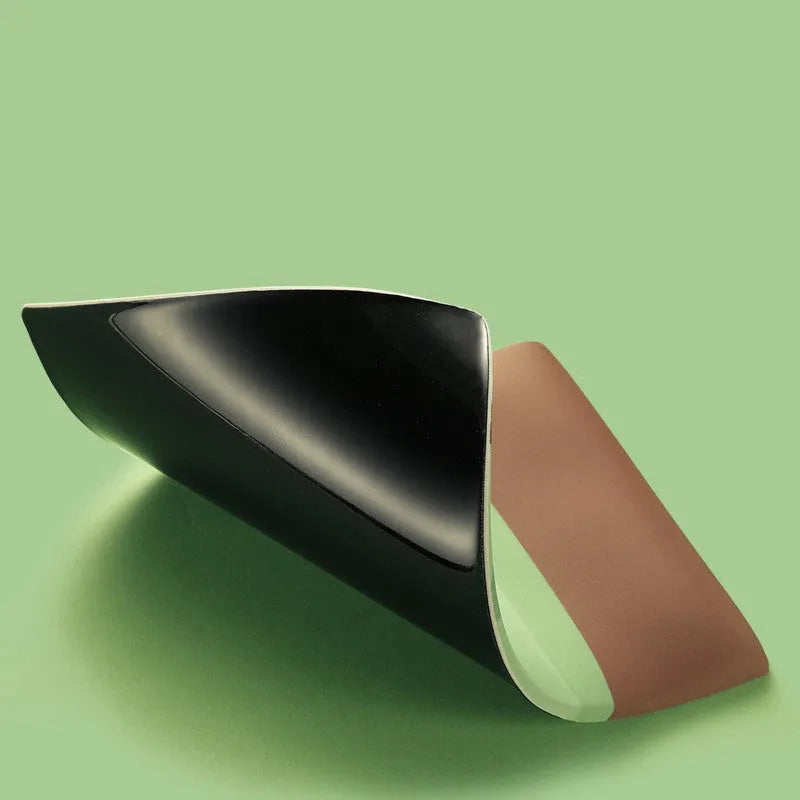 Green kiwi fruit design on a cloth mouse pad with a thick, integrated silicone wrist support cushion.
