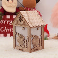 Three wooden Christmas house decorations including bell, Santa Claus and snowman designs in natural wood colour