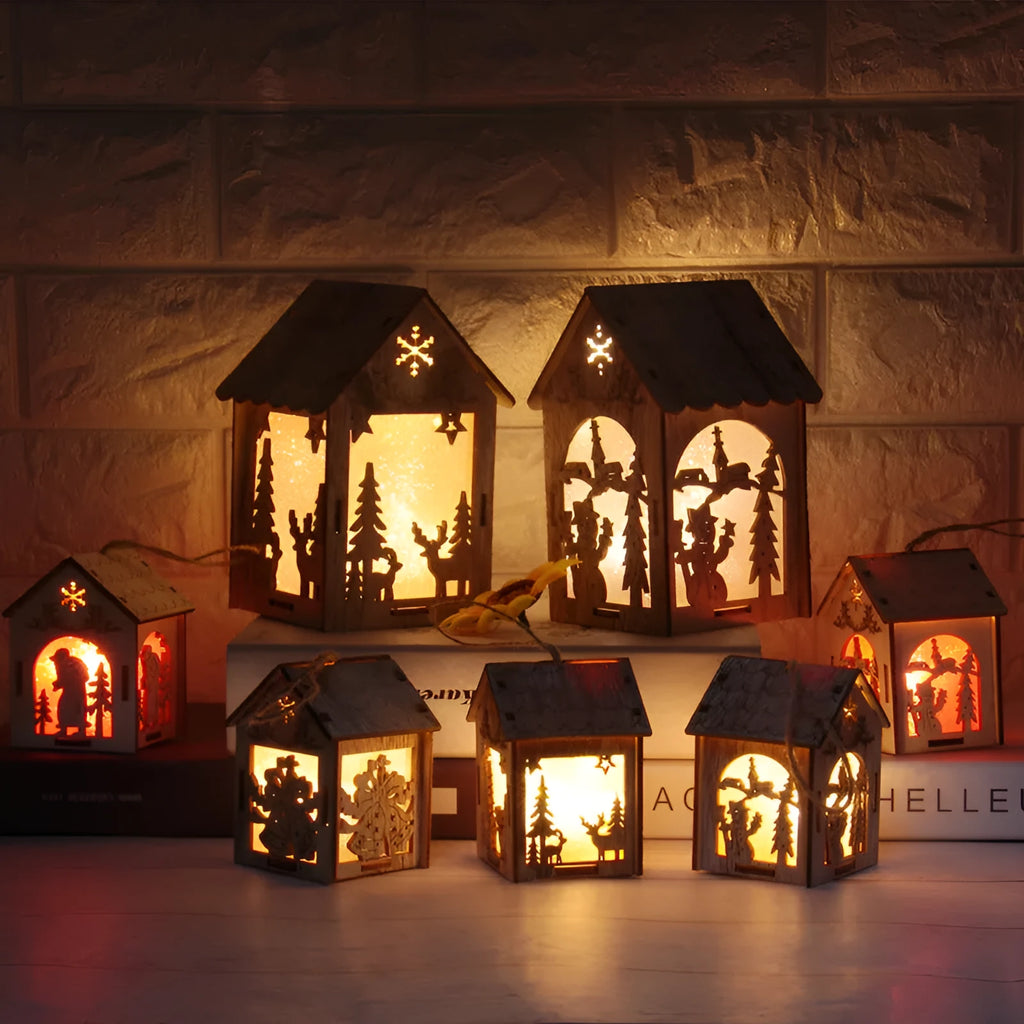 Three wooden Christmas house decorations including bell, Santa Claus and snowman designs in natural wood colour