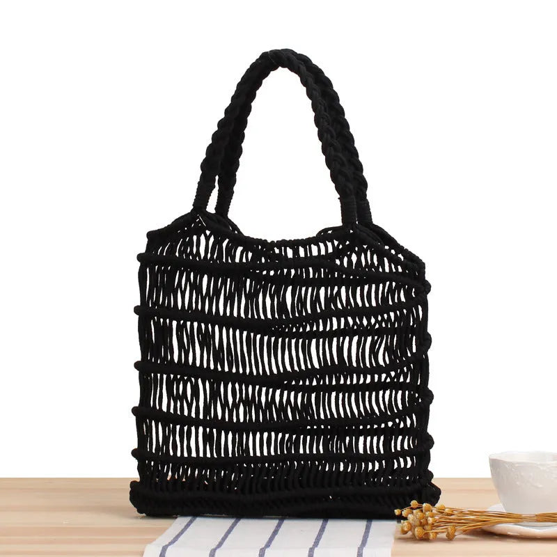 Women's woven straw shoulder bag in medium size with double straps and national style design