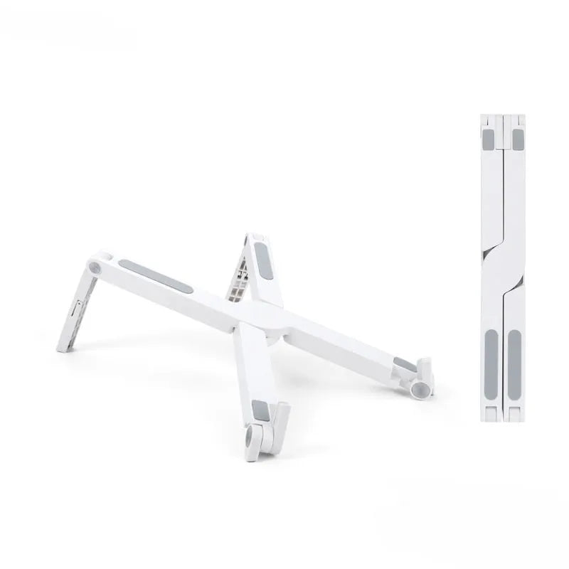 Folding aluminium alloy laptop stand in grey on a wooden desk, showing adjustable width and non-slip pads