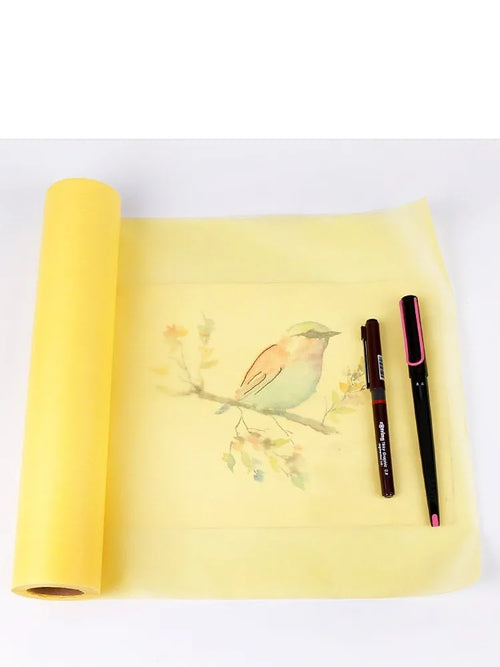 Aikale sketch scroll paper roll on a table, available in white or yellow and three different sizes.