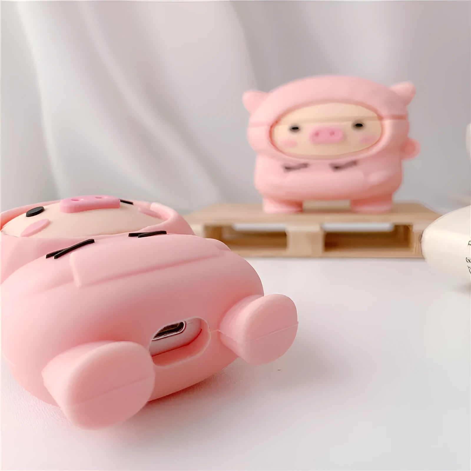 Soft silicone AirPods case cover with pink pig design and hook attachment