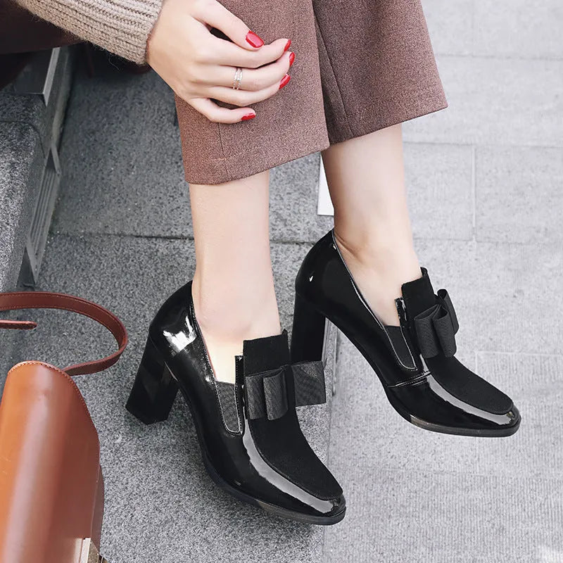 Black patent leather women's high heels with a thick 8cm heel and square toe, side view.