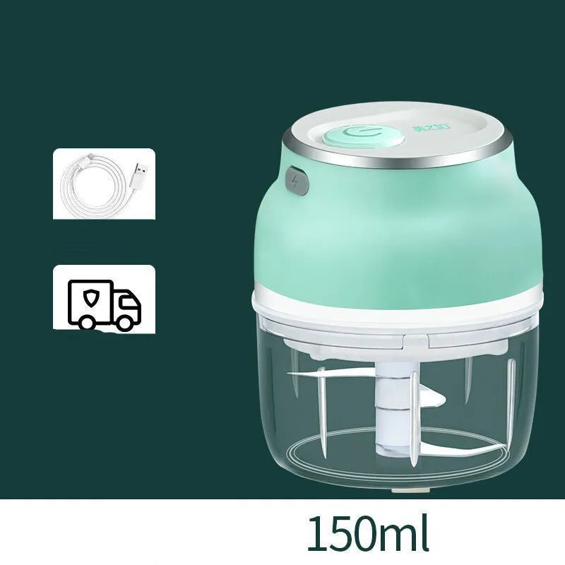 Electric food chopper with transparent cup and stainless steel blade on kitchen counter