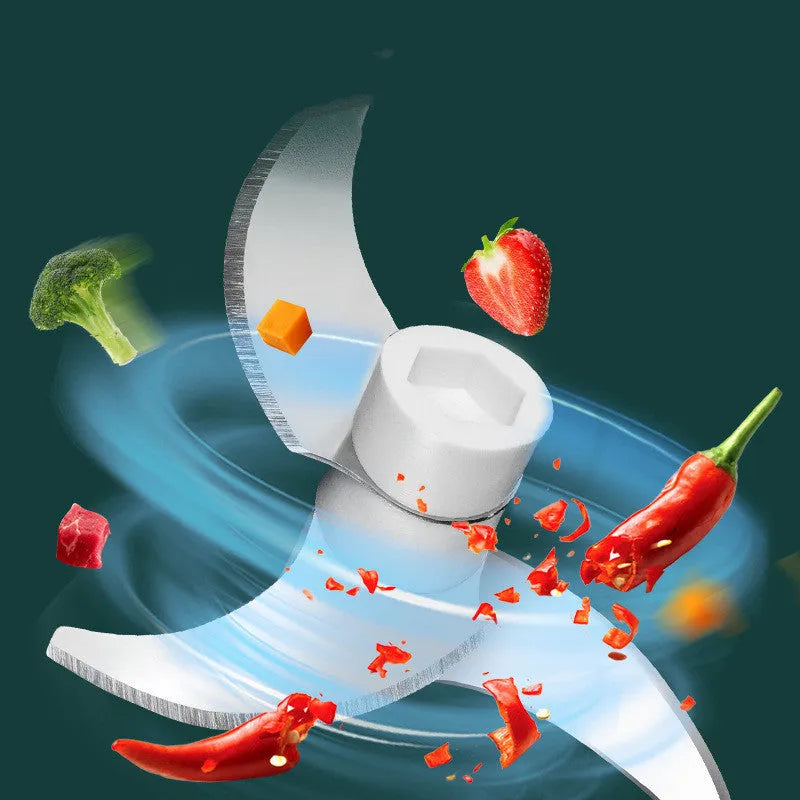 Electric food chopper with transparent cup and stainless steel blade on kitchen counter