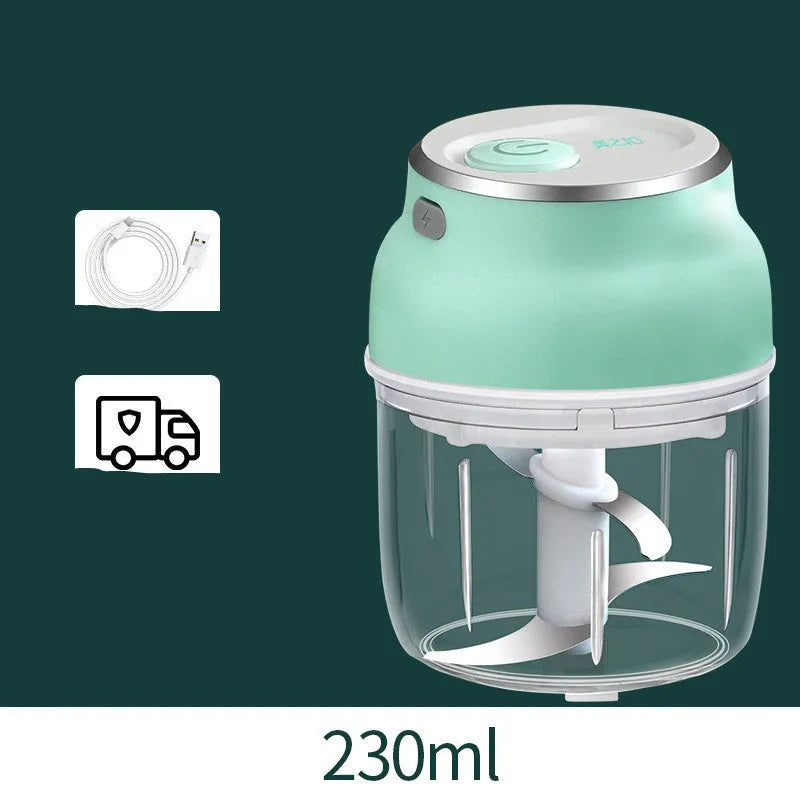 Electric food chopper with transparent cup and stainless steel blade on kitchen counter