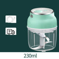 Electric food chopper with transparent cup and stainless steel blade on kitchen counter