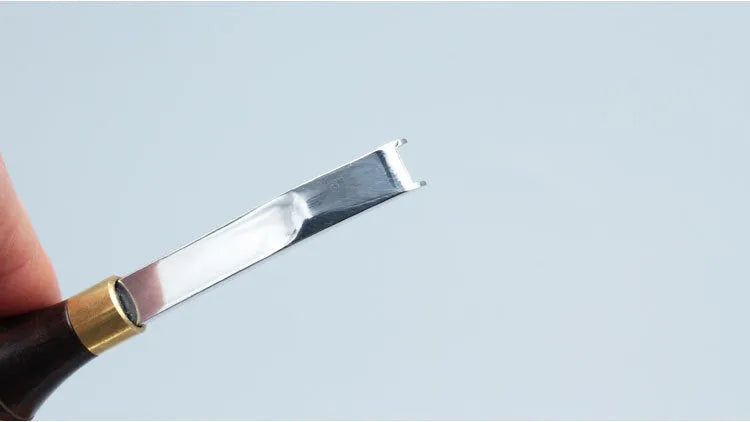 Leather thinning knife with a wide shovel edge for professional shoemaking and leatherworking.