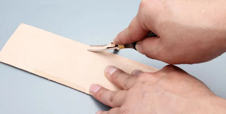 Leather thinning knife with a wide shovel edge for professional shoemaking and leatherworking.