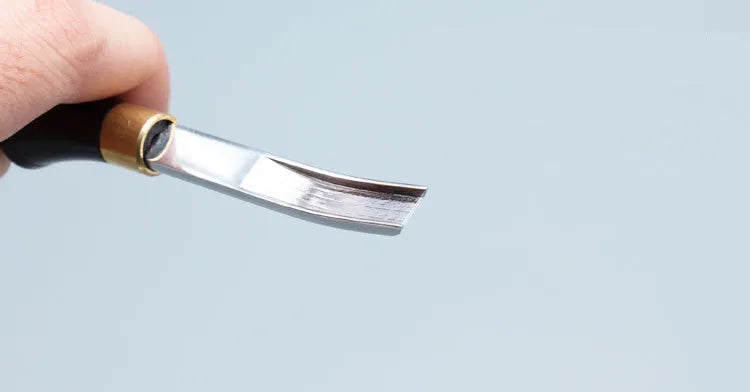 Leather thinning knife with a wide shovel edge for professional shoemaking and leatherworking.