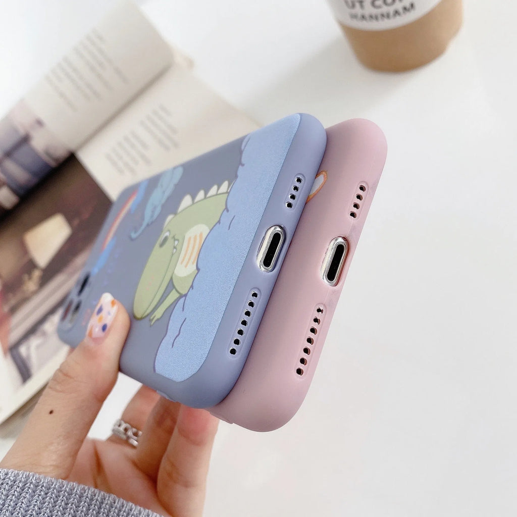 Blue TPU iPhone case with printed dinosaur cartoon design shown on iPhone 12 mini