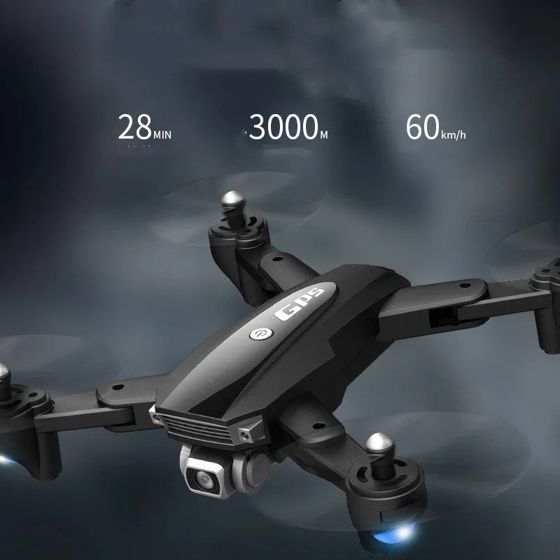 Black and red folding quadrocopter children's toy with 4K camera on a grassy field.