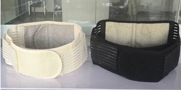 Black self-heating magnetic waist protection belt laid flat, showing its elastic cloth material and fastener.
