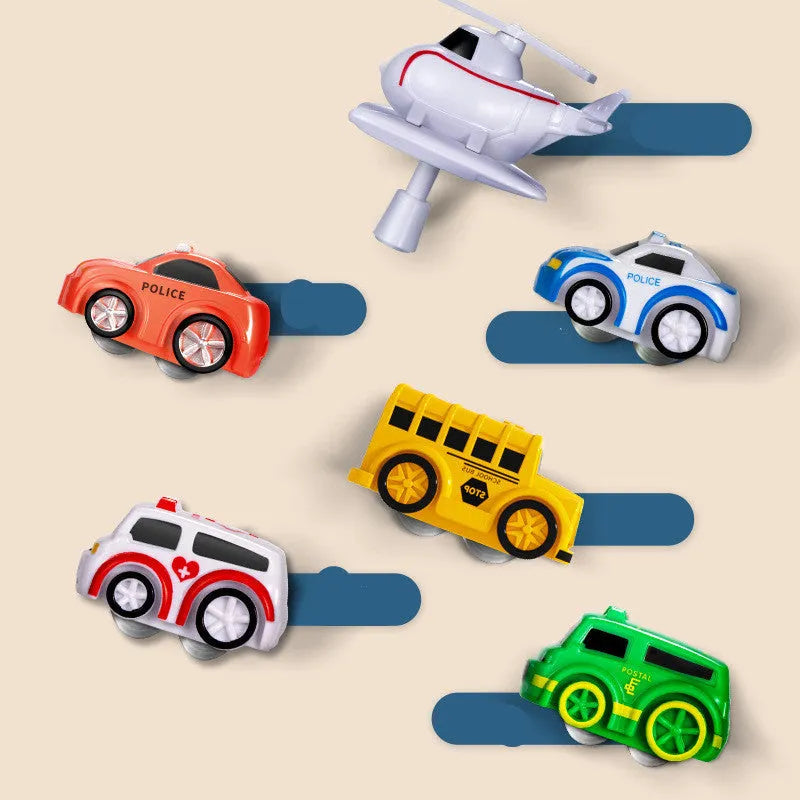 Children's parking lot car track toy with conveyor belt, crane, and toy vehicles including police car and ambulance