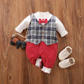Baby boy wearing a navy blue long-sleeved cotton jumpsuit with gentleman styling.