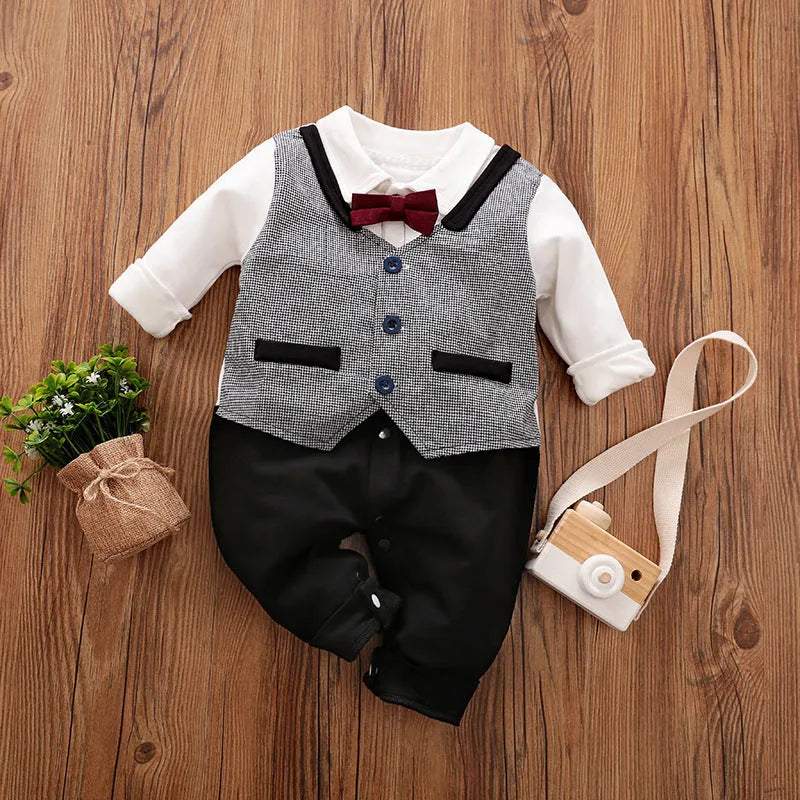 Baby boy wearing a navy blue long-sleeved cotton jumpsuit with gentleman styling.