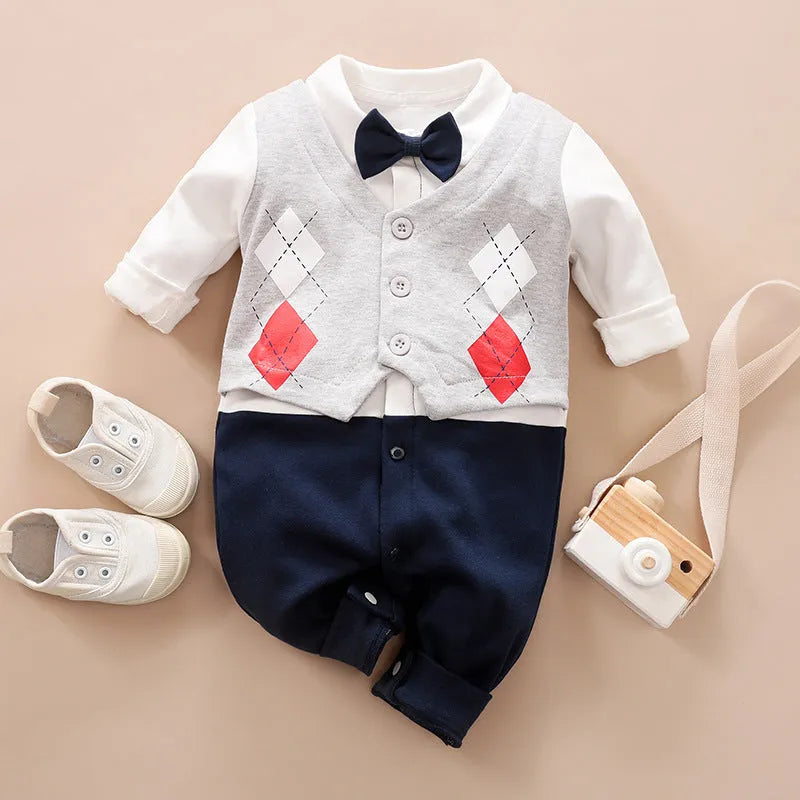 Baby boy wearing a navy blue long-sleeved cotton jumpsuit with gentleman styling.