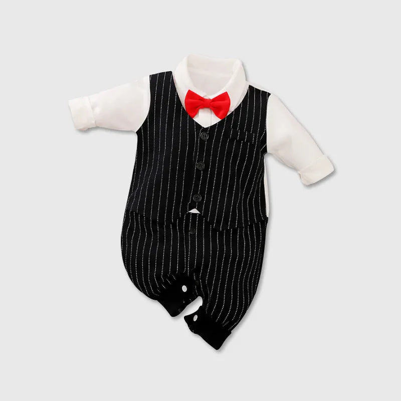 Baby boy wearing a navy blue long-sleeved cotton jumpsuit with gentleman styling.