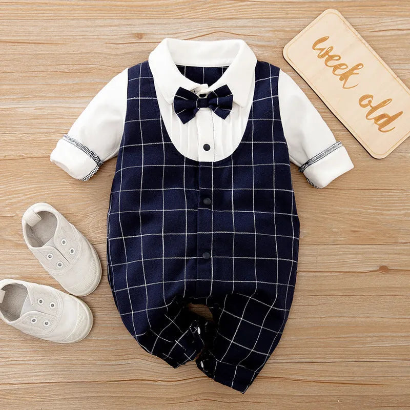 Baby boy wearing a navy blue long-sleeved cotton jumpsuit with gentleman styling.