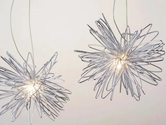 Adjustable aluminium wire star moon chandelier with zinc alloy and iron frame, showing warm light illumination.