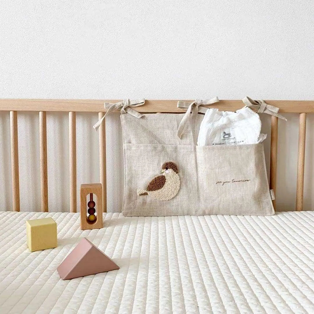Khaki coloured cotton linen hanging storage bag with one pocket for bedside organisation