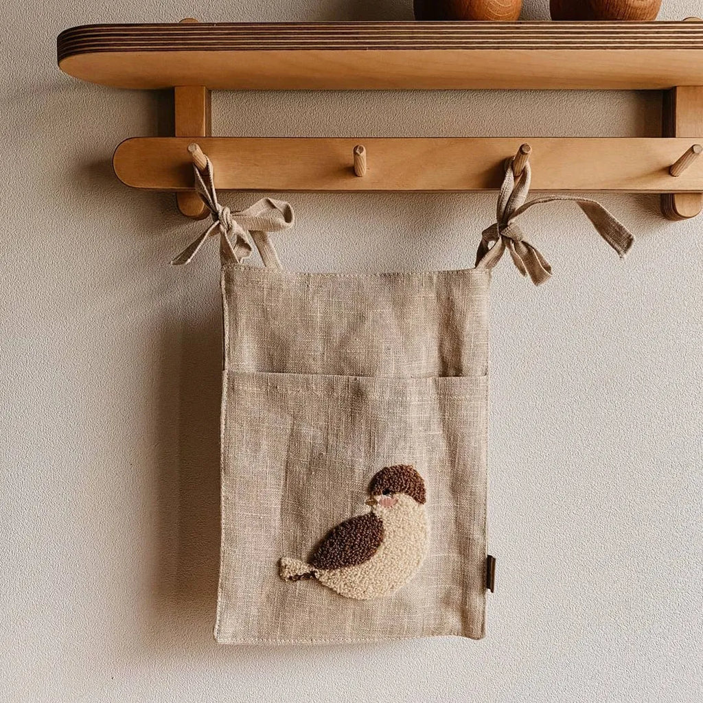 Khaki coloured cotton linen hanging storage bag with one pocket for bedside organisation