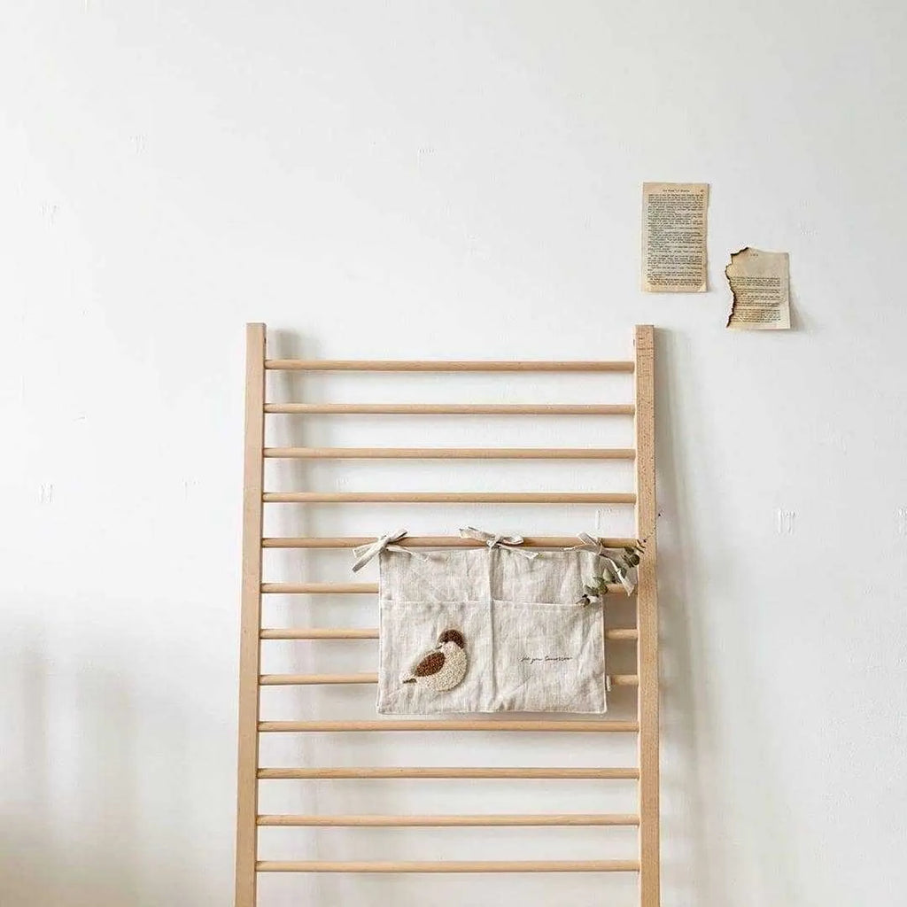 Khaki coloured cotton linen hanging storage bag with one pocket for bedside organisation