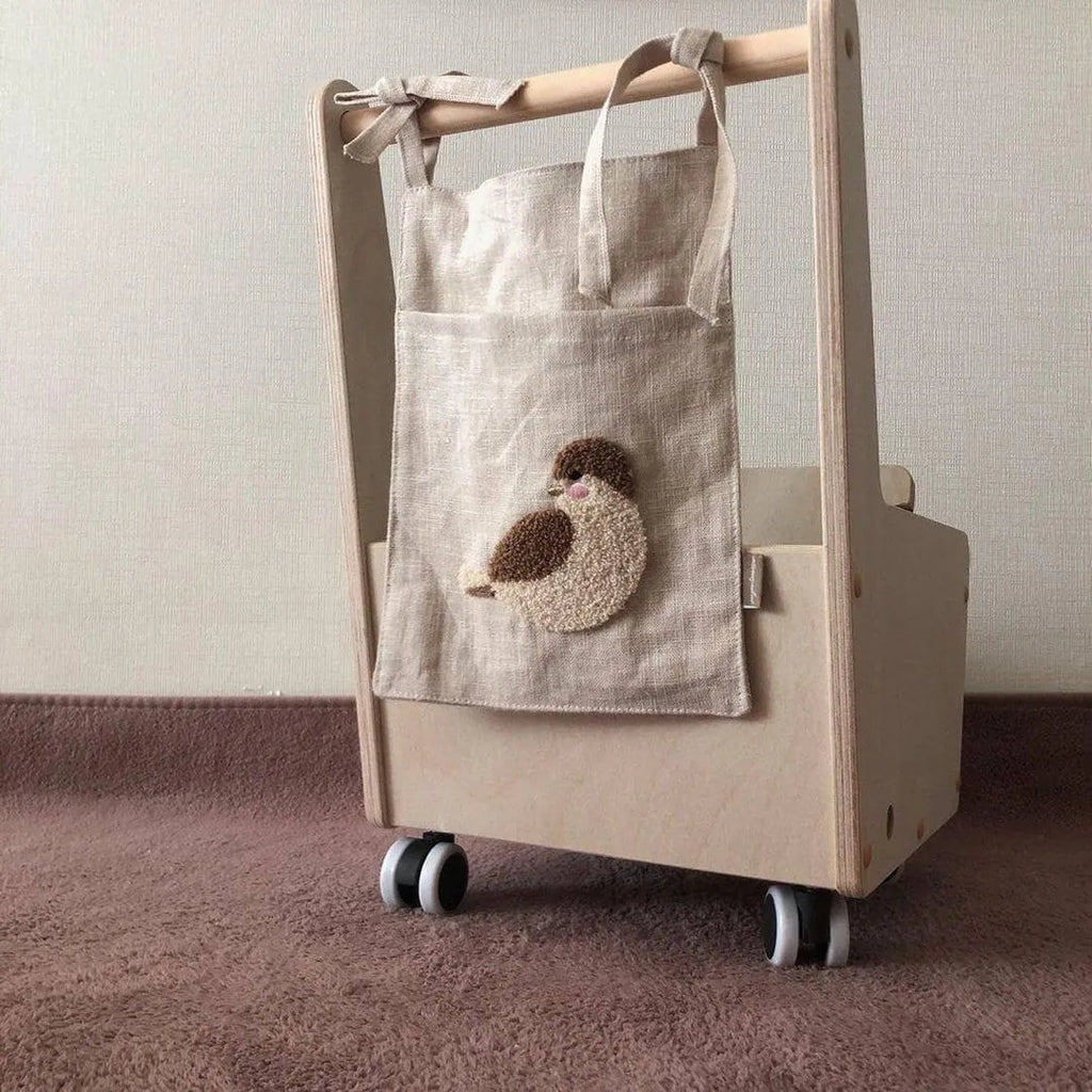 Khaki coloured cotton linen hanging storage bag with one pocket for bedside organisation