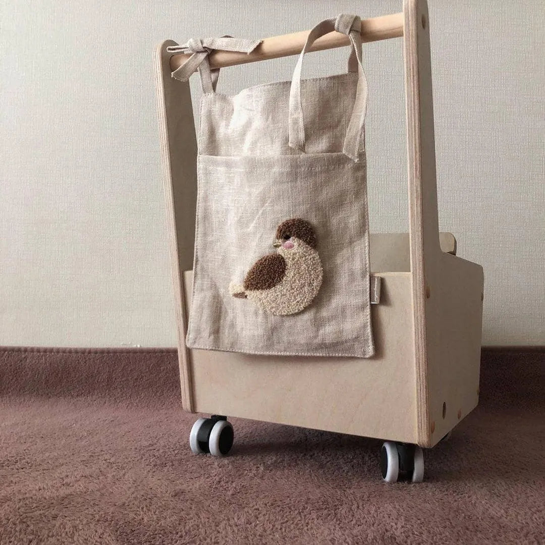Khaki coloured cotton linen hanging storage bag with one pocket for bedside organisation