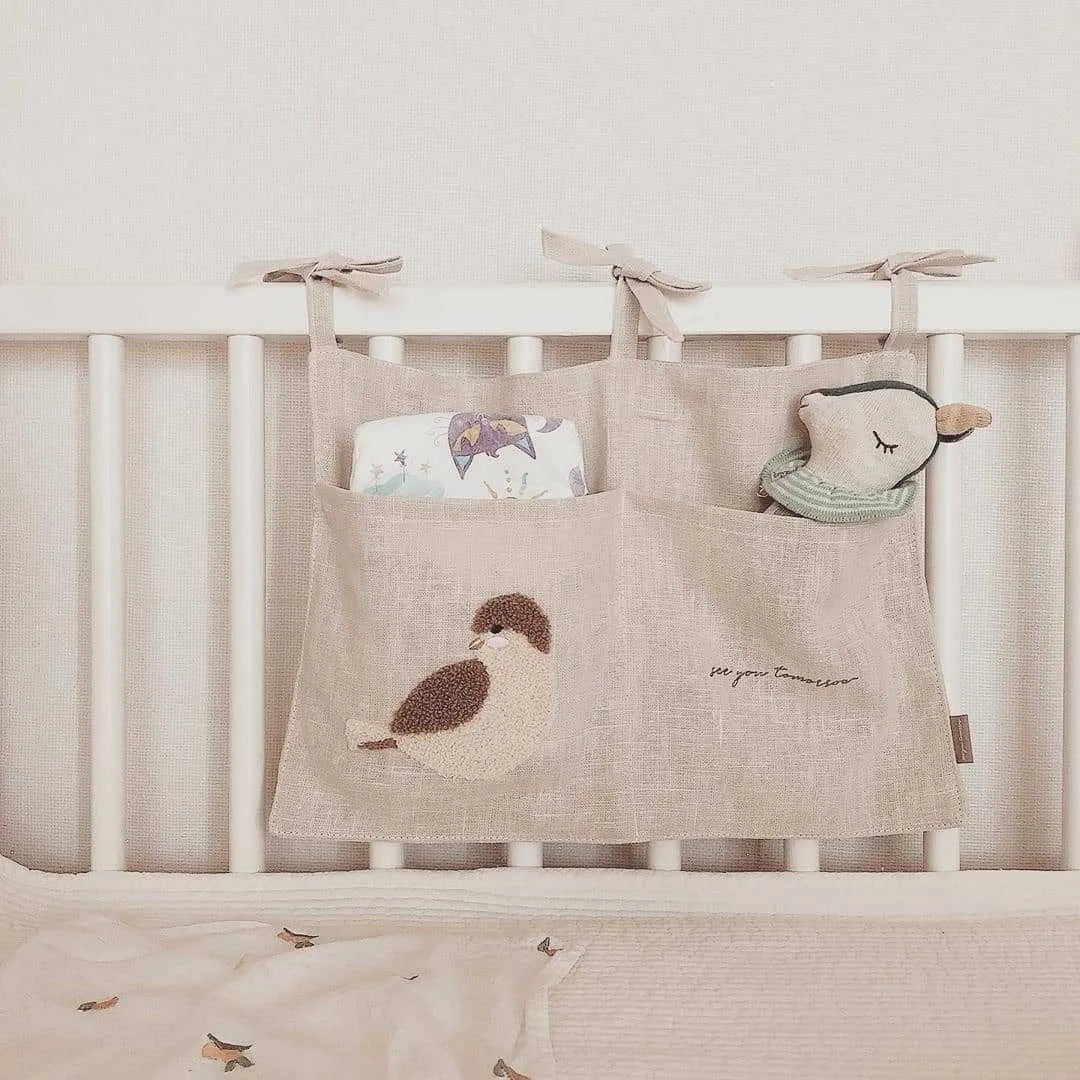 Khaki coloured cotton linen hanging storage bag with one pocket for bedside organisation