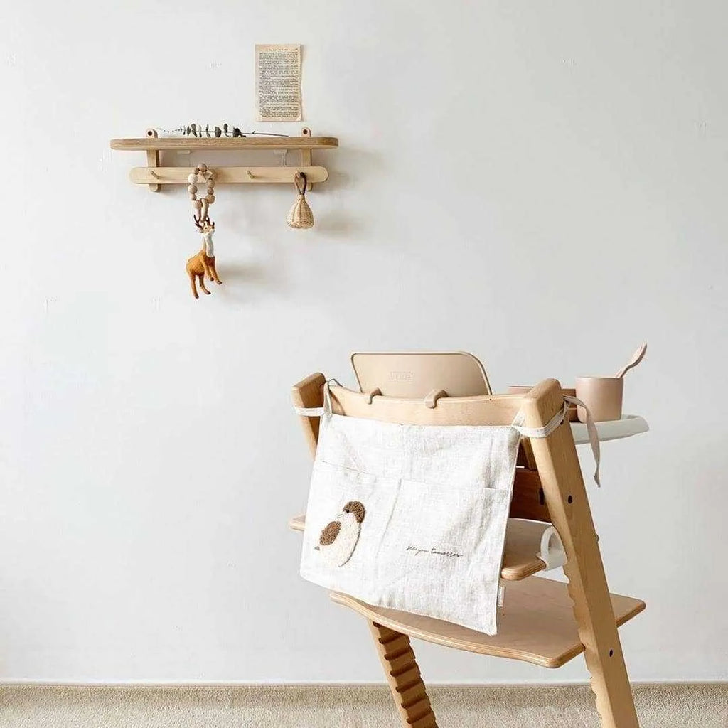Khaki coloured cotton linen hanging storage bag with one pocket for bedside organisation