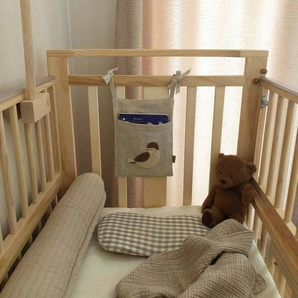 Khaki coloured cotton linen hanging storage bag with one pocket for bedside organisation