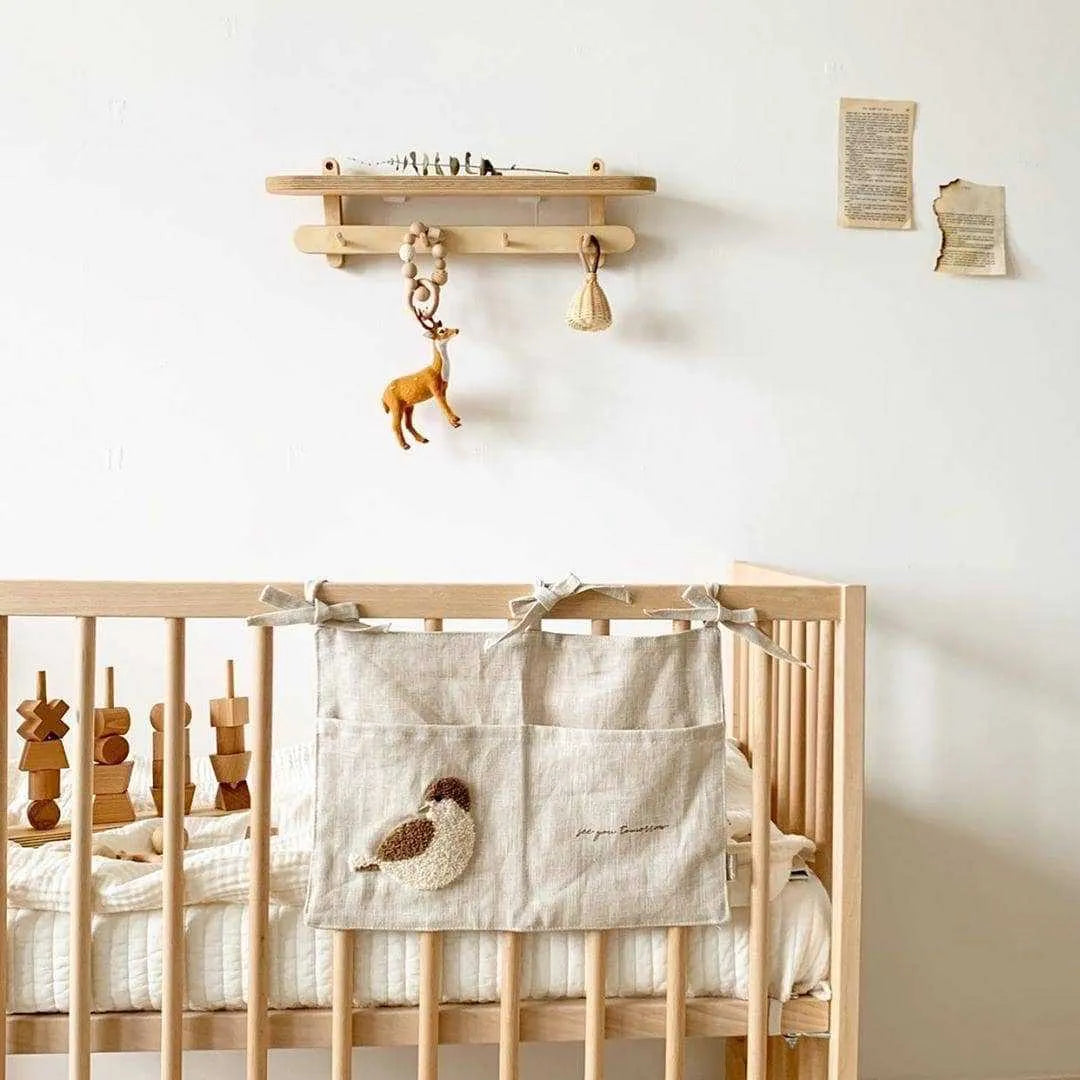 Khaki coloured cotton linen hanging storage bag with one pocket for bedside organisation