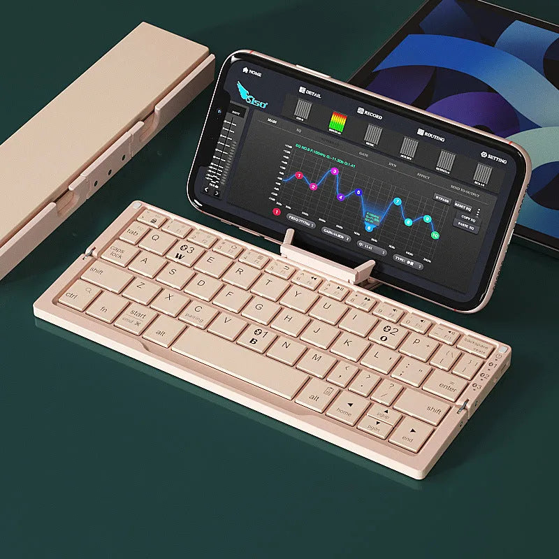 Aluminium folding Bluetooth keyboard with stand holding a smartphone