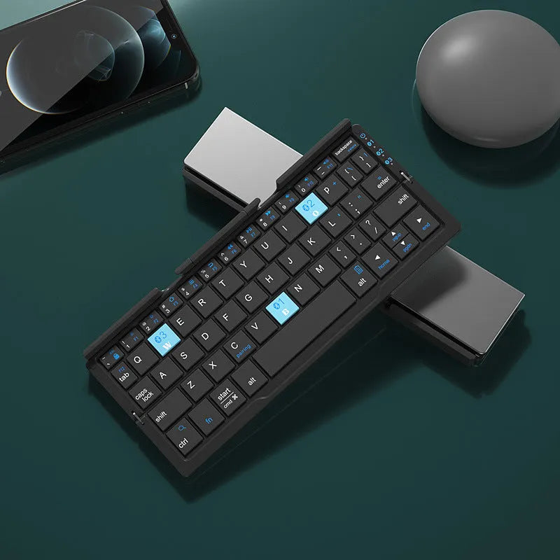 Aluminium folding Bluetooth keyboard with stand holding a smartphone