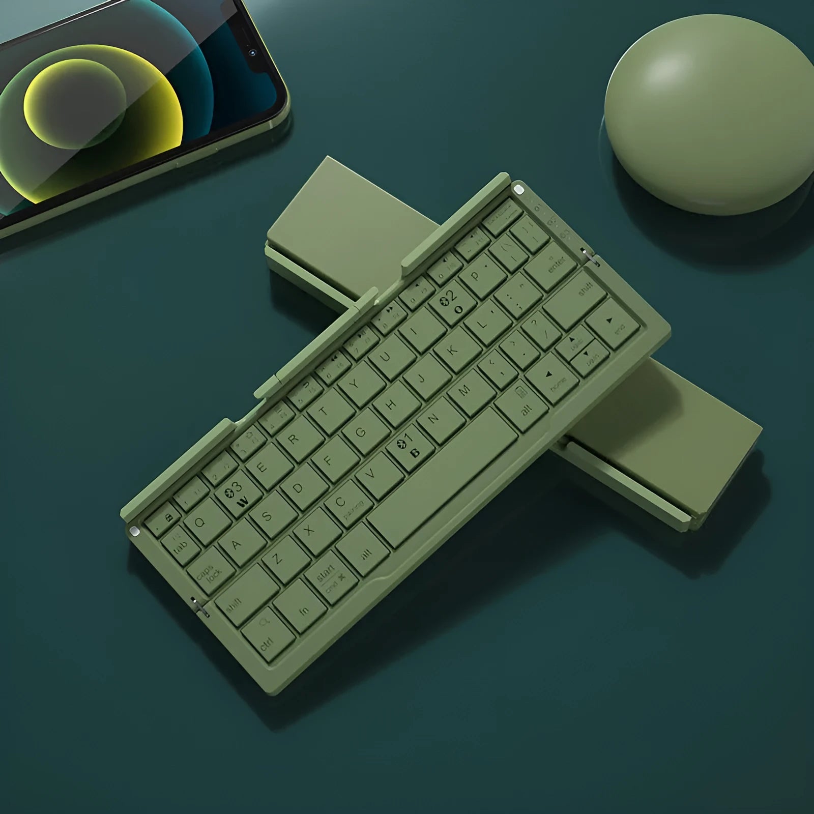 Aluminium folding Bluetooth keyboard with stand holding a smartphone