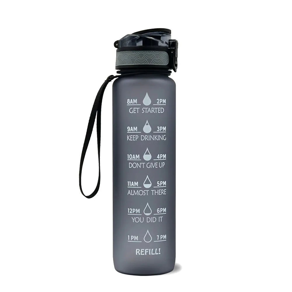 Blue and red gradient 1 litre Tritan sports water bottle with time markers and flip-top lid