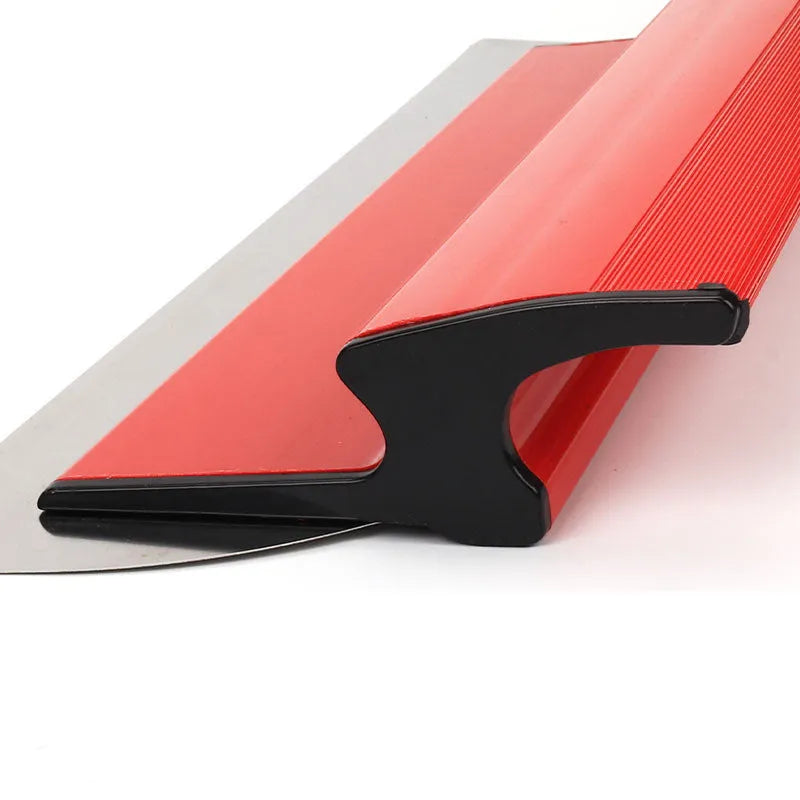 Red metal leveling scraper tool with a 40cm long blade for wall preparation.