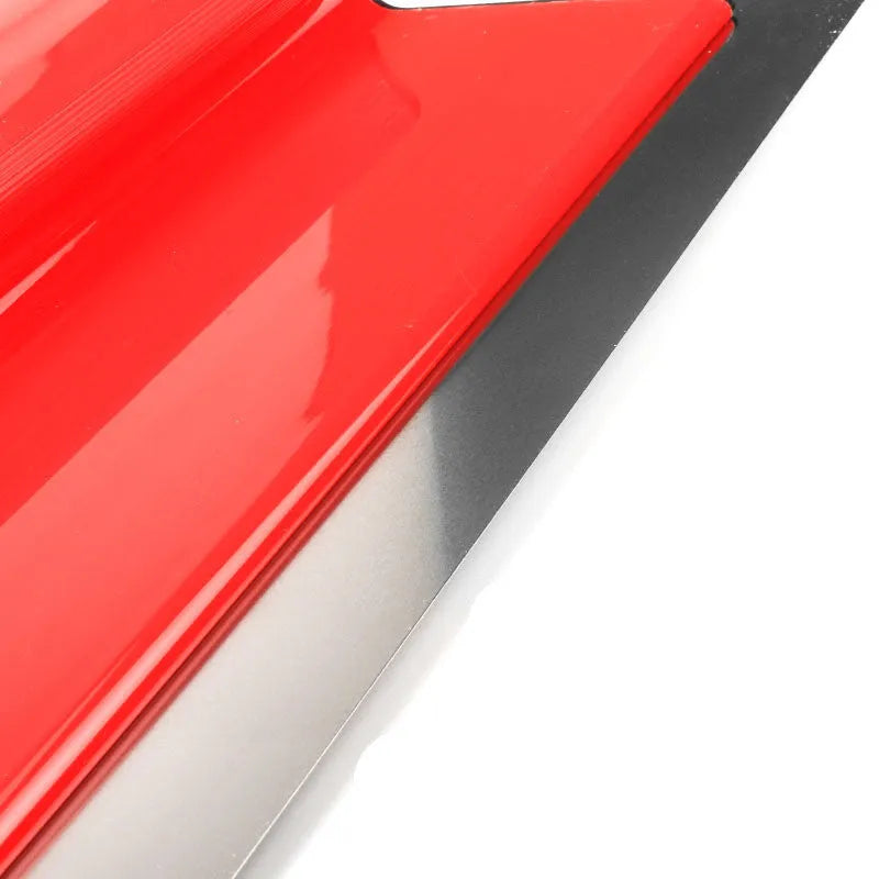 Red metal leveling scraper tool with a 40cm long blade for wall preparation.