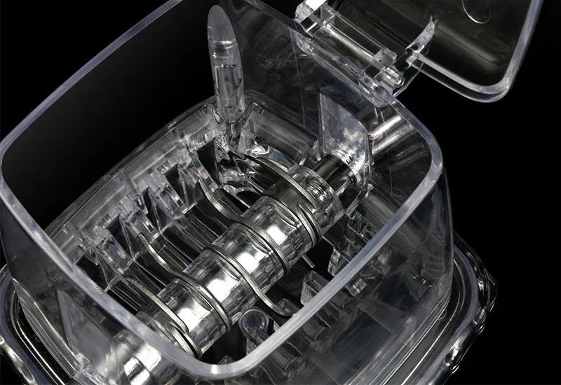 Manual ice crusher with transparent plastic body and stainless steel blade on a kitchen counter