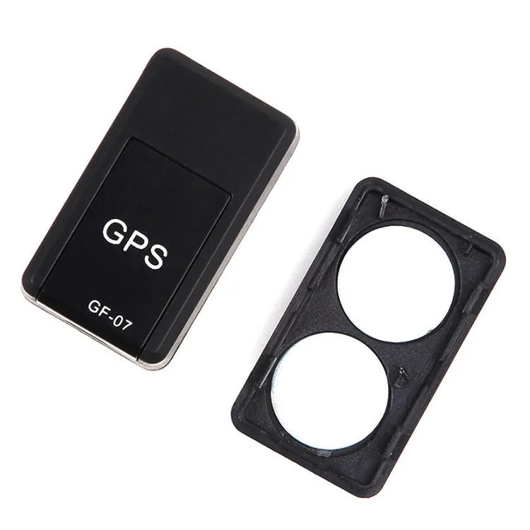 Small black magnetic GPS tracker device shown next to a USB charging cable.