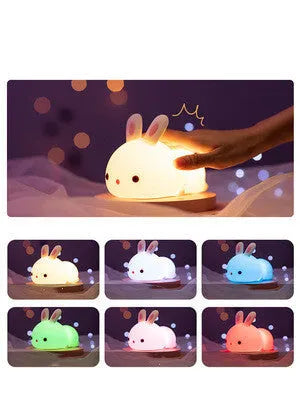 Rabbit silicone pat night light with seven-colour LED on a study desk